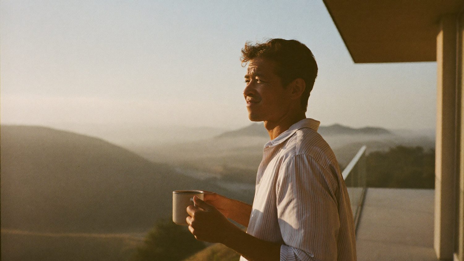 Business owner enjoying a calm morning with coffee, the day’s work already handled